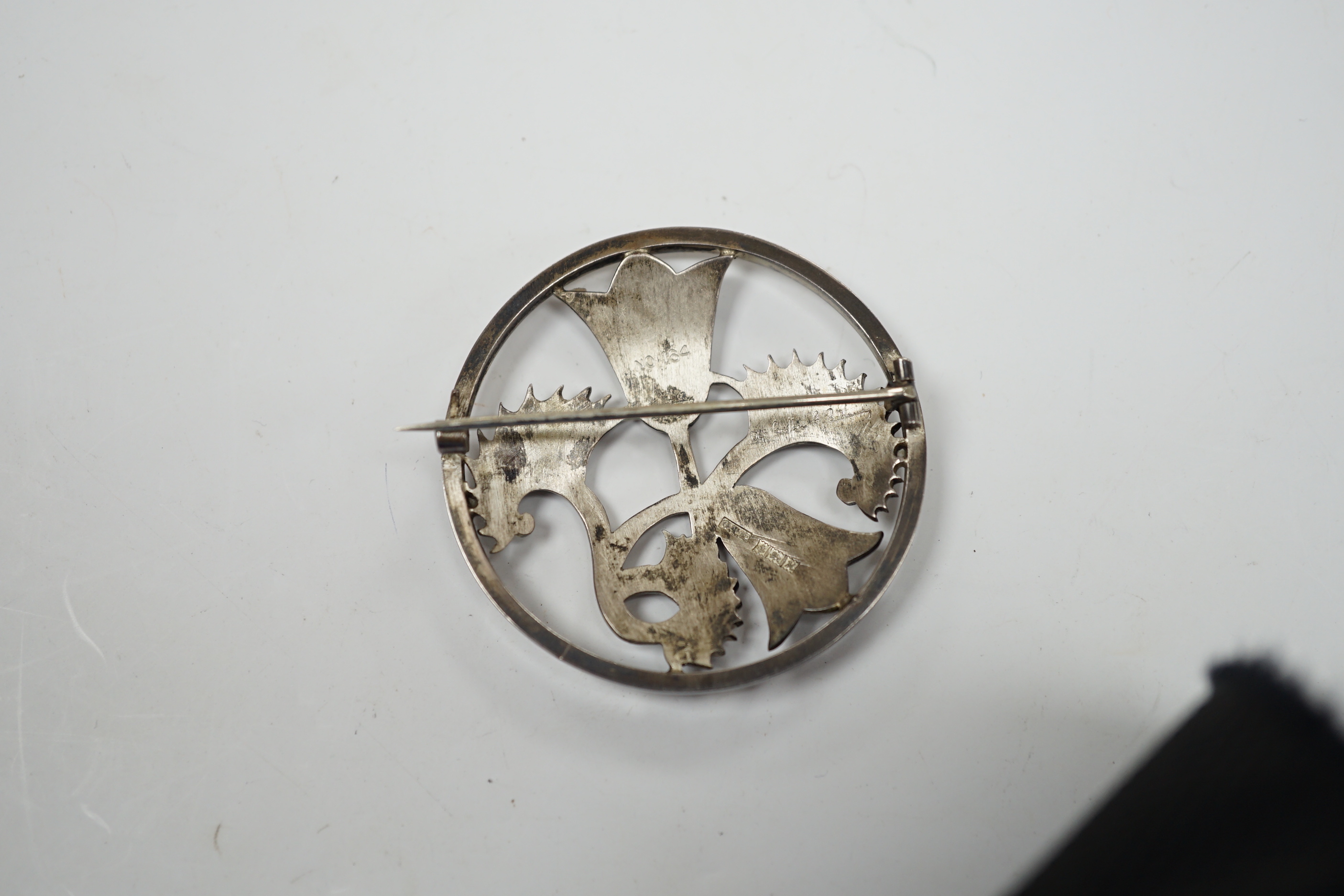 An Elizabeth II Geoffrey G. Bellamy for George Tarratt Ltd silver circular 'flower and fern' brooch, no. 164, Birmingham, 1961, 43mm.